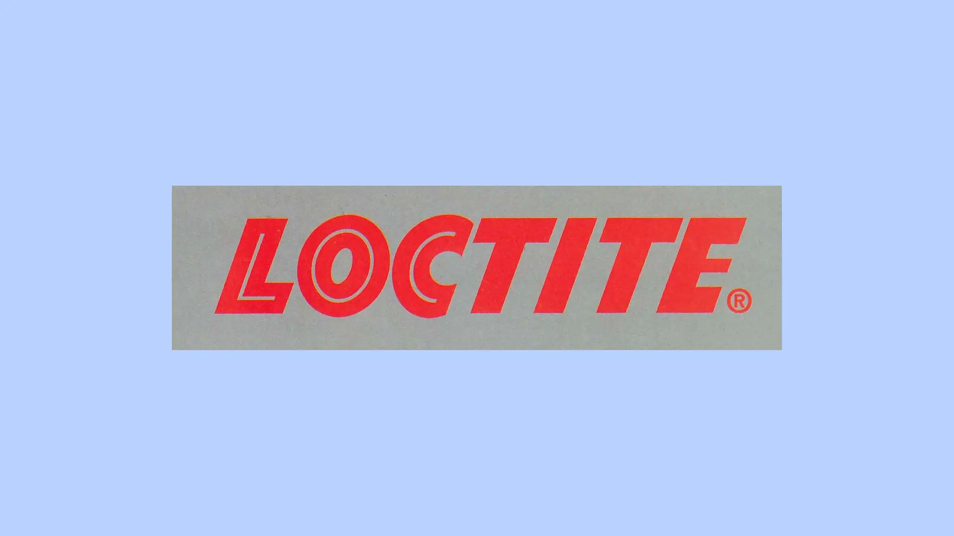 El logotipo rojo de Loctite sobre un fondo gris.